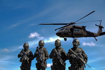 Soldiers and helicopter flying above